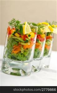 Tasty salad served in glasses