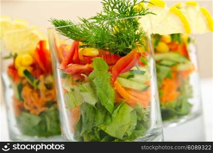 Tasty salad served in glasses