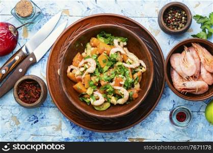 Tasty salad with tamarillo,avocado and shrimp.Healthy salad with fresh seafood. Salad with tamarillo,shrimps and avocado