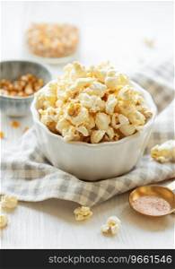 Tasty salted homemade popcorn. Making healthy popcorn at home