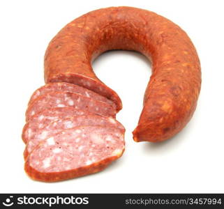 Tasty sausage is curtailed by a ring lies on a white background