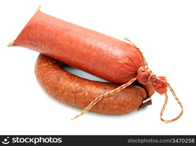 Tasty sausage is curtailed by a ring lies on a white background