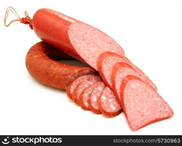 Tasty sausage is curtailed by a ring lies on a white background