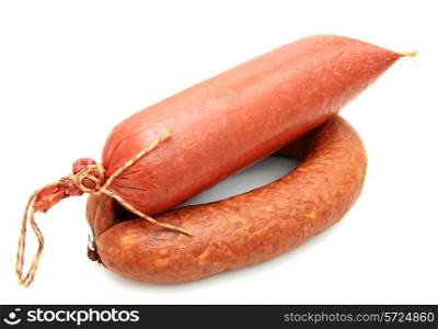Tasty sausage is curtailed by a ring lies on a white background&#xA;