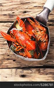 tasty seafood shellfish served in metal pot. shellfish in the pan