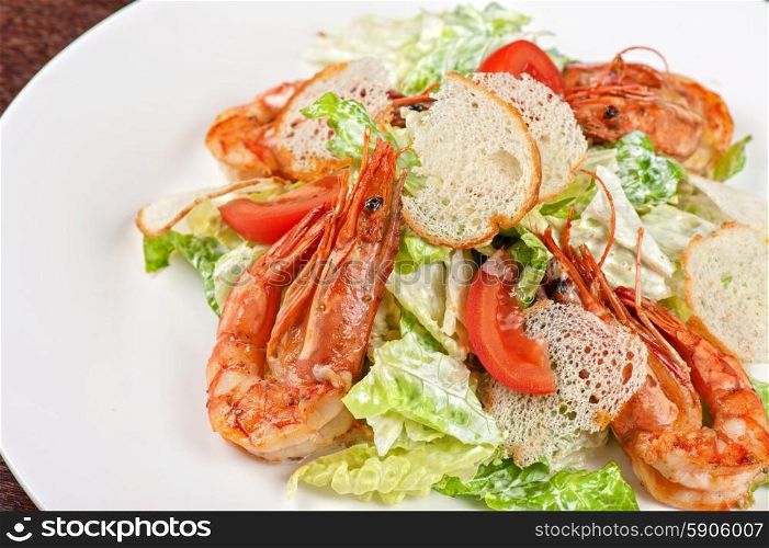 Tasty shrimp salad. Tasty shrimp salad with vegetables on christmas table
