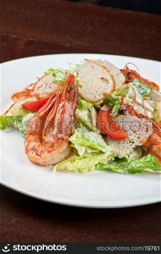 Tasty shrimp salad with vegetables on christmas table. Tasty shrimp salad