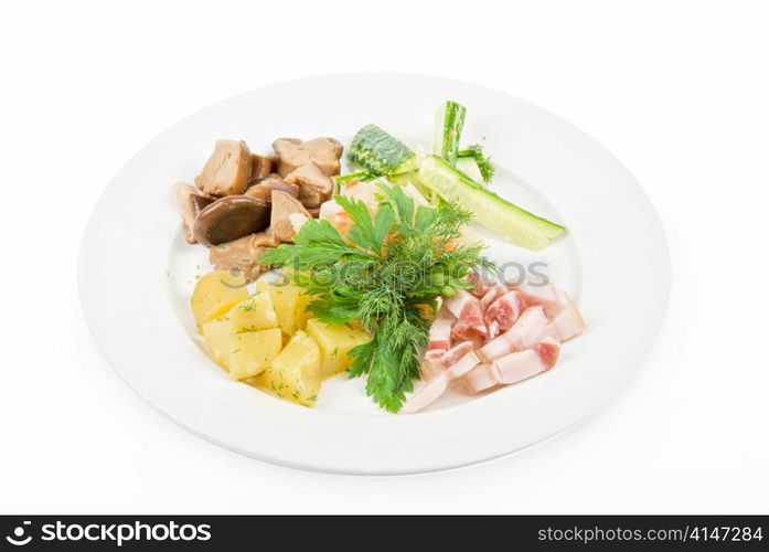 Tasty snacks: potato, fat and vegetables at plate isolated on a white