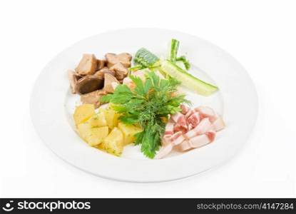Tasty snacks: potato, fat and vegetables at plate isolated on a white