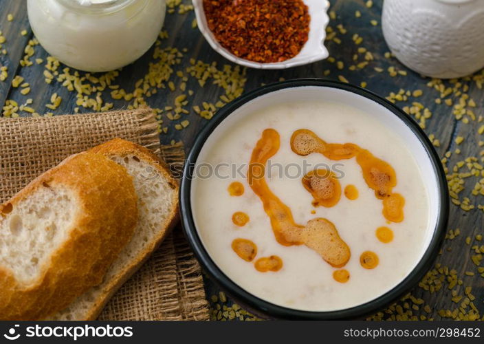 Tasty traditional soup and bread on wooden table.Top view.