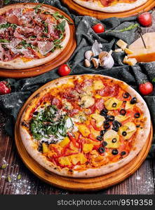 Tasty two pizzas on a wooden background