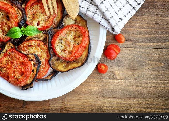 Tasty vegetarian pizza topping, delicious baked eggplant with tomato and cheese, traditional italian food, healthy organic nutrition