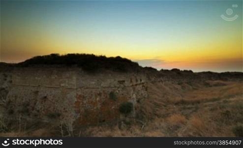 Tatar-Turkish fortress at sunset. Azov coast of Crimea, Ukraine. Timelapse.