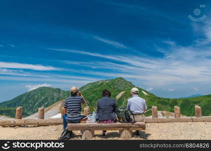 Tateyama, Japan - August 17, 2013: Unidentified tourists &#xA;relxing and look on panoramic view of Mountains&#xA;Tateyama Kurobe Alpine Route, Japanese Alps in Tateyama, Japan