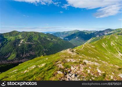 Tatra Mountain (Poland) morning summer view from Kasprowy Wierch range. People are unrecognizable.