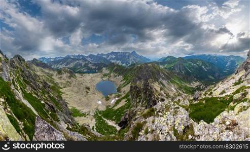 Tatra Mountain view to group of glacial lakes from path Kasprowy Wierch to Swinica mount, Poland. Panorama.