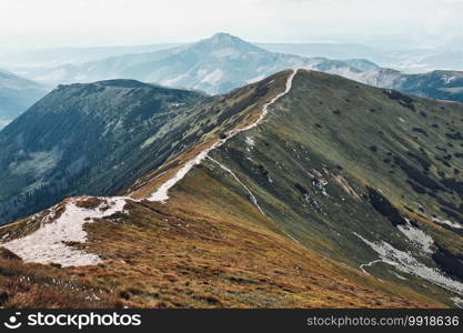 Tatra Mountains landscape. Scenic view of mountain rocky peaks, slopes, hills and valleys covered with grass, mugo pine and trees. Tatra Mountains landscape. Scenic view of mountain rocky peaks, slopes, hills and valleys