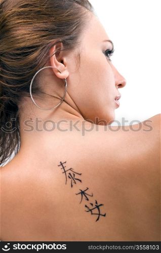 Tattoo on a back of the young woman. Isolated 3
