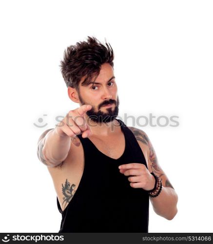Tattooed guy with beard pointing something with his finger isolated on a white background