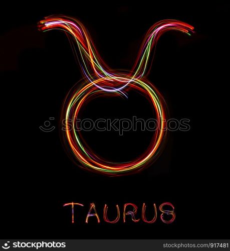""Taurus",Zodiac sign from led light on black background. "