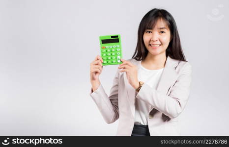 Tax day concept. Woman confident smiling holding electronic calculator, Portrait excited happy Asian young female studio shot isolated on white background, Business Account and finance counting income