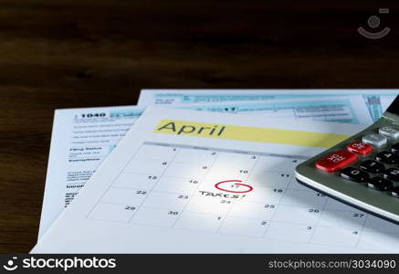 Tax day for 2017 returns is April 17, 2018. Calendar on top of form 1040 income tax form for 2017 showing tax day for filing is April 17 2018. Tax day for 2017 returns is April 17, 2018