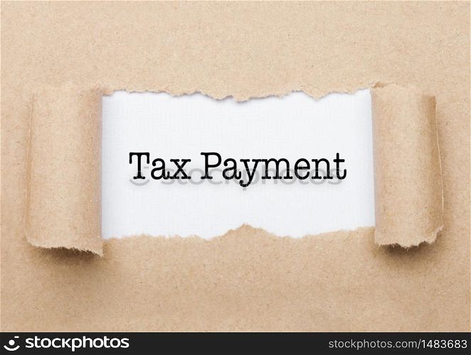 Tax Payment concept text appearing behind torn brown paper envelope
