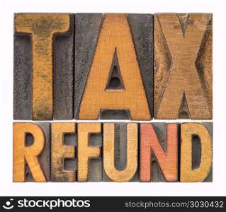 tax refund word abstract in wood type. tax refund - isolated word abstract in vintage letterpress printing blocks