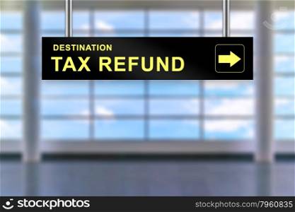 tax refund word on airport sign board with blurred background