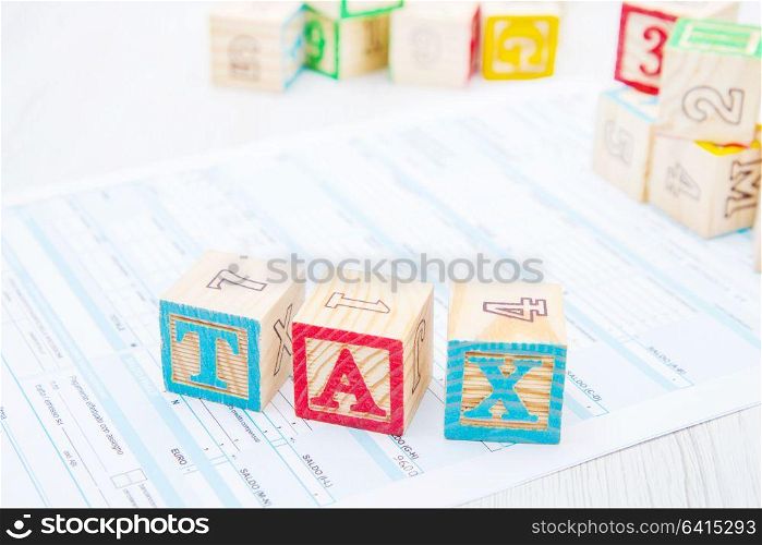 tax written on wooden cubes