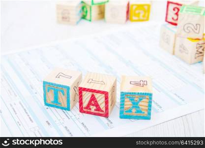 tax written on wooden cubes