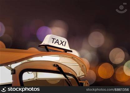Taxi car on street and bokeh at night life