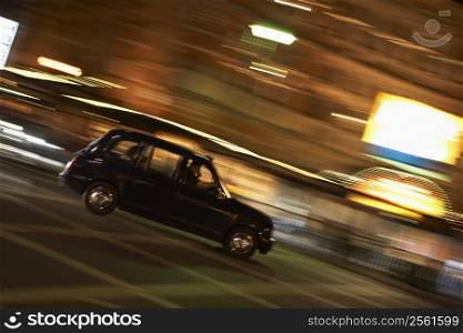 Taxi Driving Through Night Time Street