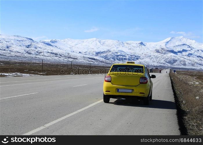 Taxi driving to mount Ararat. Taxi driving along a long road to mount Ararat in Turkey