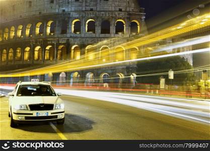 Taxi in waiting for passengers near Colosseum. Rome. Italy.