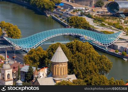 Tbilisi. Bridge across the Kura River.. Pedestrian bridge over the river Kura in Tbilisi. Georgia.