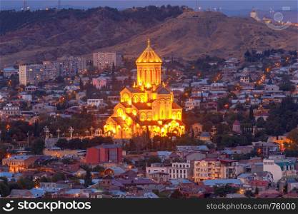 Tbilisi. View of the city at night.. Scenic aerial view of the city and cathedral at sunset. Tbilisi. Georgia.