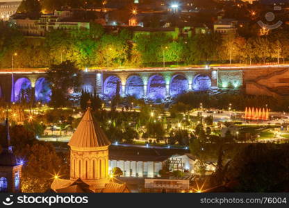 Tbilisi. View of the city at night.. Scenic aerial view of the city at sunset. Tbilisi. Georgia.