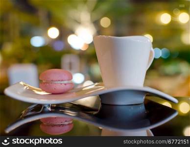 Tea and Macaroon on the table.