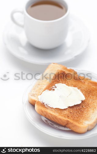 tea and toast with butter isolated on white