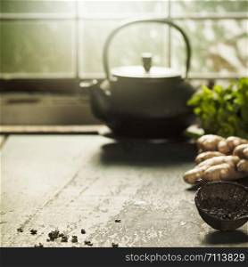Tea composition near the old window, close up. Tea composition on wooden table, close up