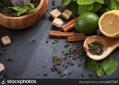 tea composition with cinnamon sticks, lemons