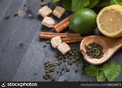 tea composition with cinnamon sticks, lemons