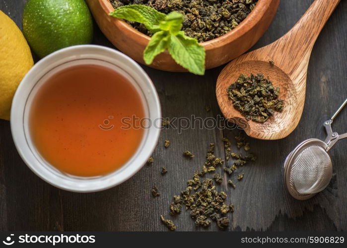 tea composition with cinnamon sticks, lemons