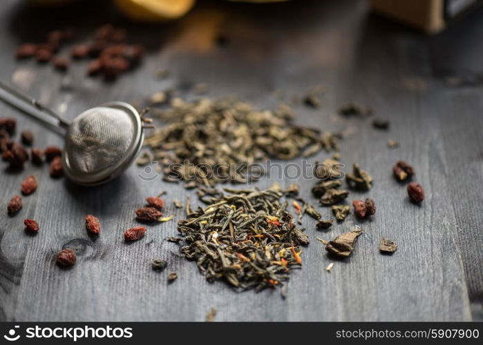 tea composition with cinnamon sticks, lemons