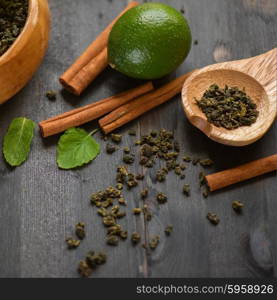 tea composition with cinnamon sticks, lemons