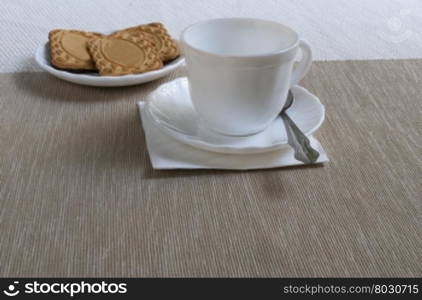 tea Cup and saucer with cookies. white tea Cup and saucer with biscuits on the table