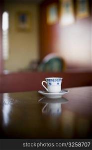 Tea cup with a saucer on the table