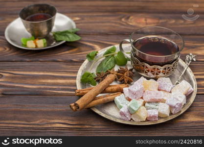 tea cup with turkish delight wooden table