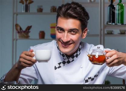 Tea expert brewing cup of drink